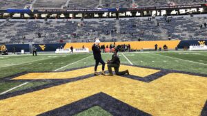 She said 'yes': USAF Capt. "Shake" Shekhawat proposes in middle of Mountaineer Field